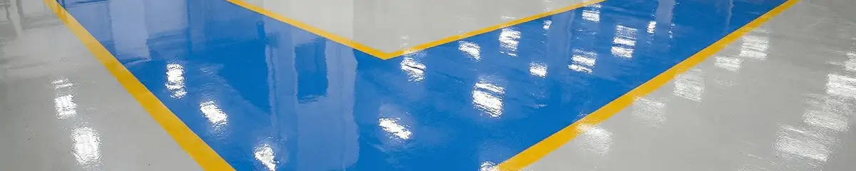 A factory floor professionally covered and marked with epoxy flooring in Seattle, WA