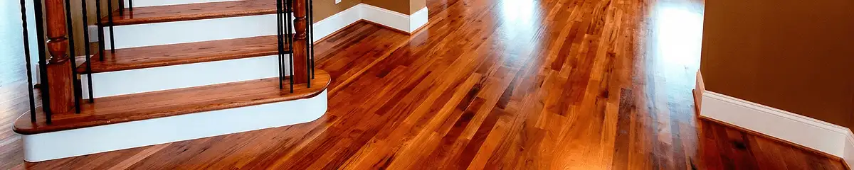 Base floor of a staircase with professionally restored wood flooring in Seattle WA