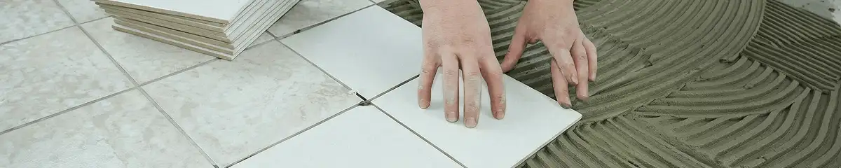 Professional installing white tile floors in Seattle, WA