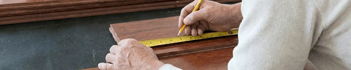 A professional installing wood flooring in Seattle, WA